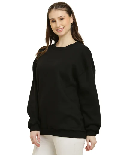 side view of our women Black Oversize Sweatshirt showcased by our model