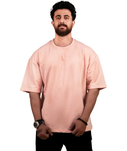 front view of our peach oversize t-shirt showcased by our model