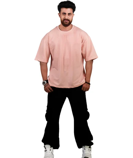 front view of our peach oversize t-shirt showcased by our model