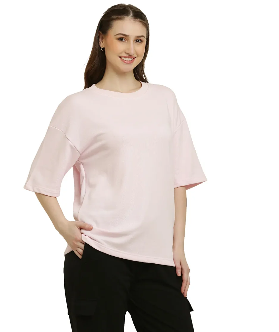 side look of Baby Pink oversize t-shirt worn by female model