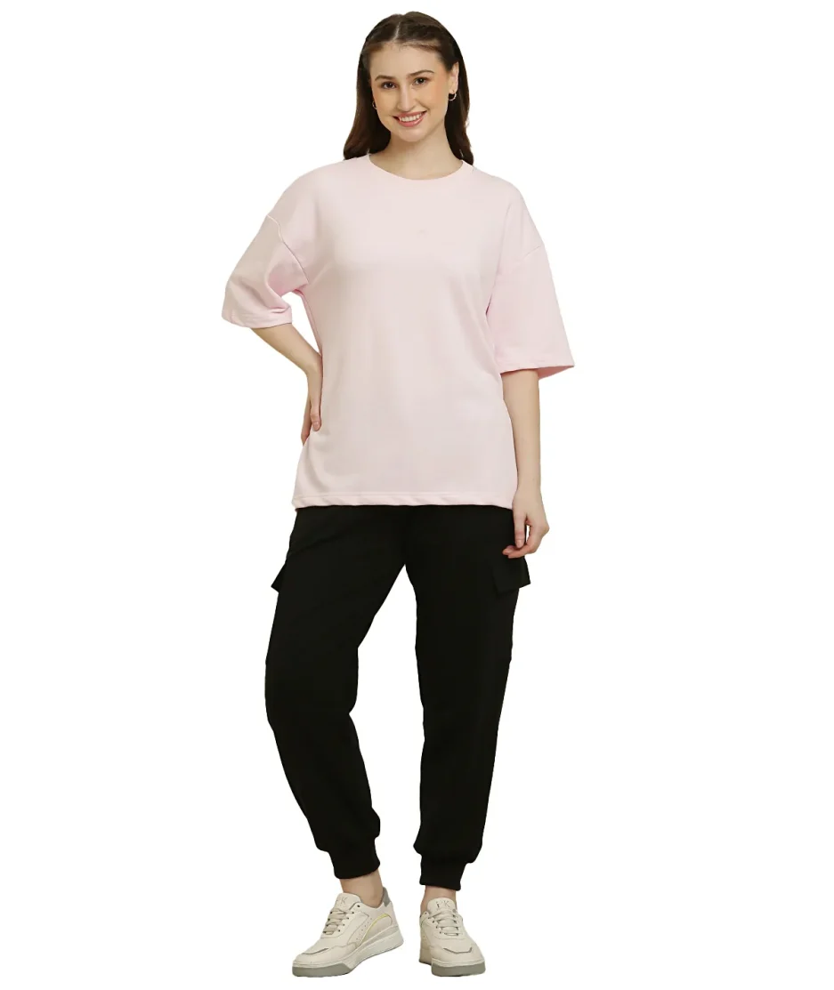 front look of Baby Pink oversize t-shirt worn by female model