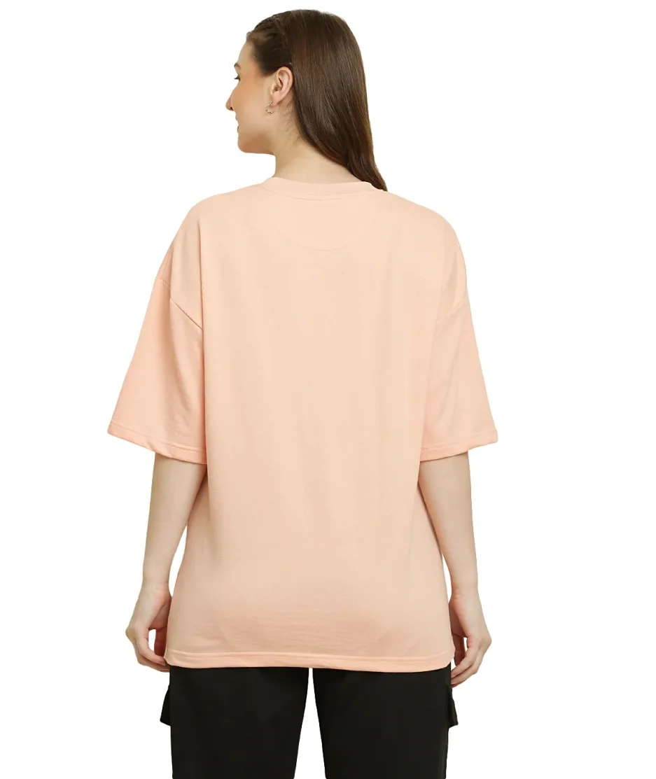 front view of peach oversize t-shirt worn by female model