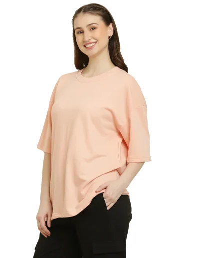 front view of peach oversize t-shirt worn by female model