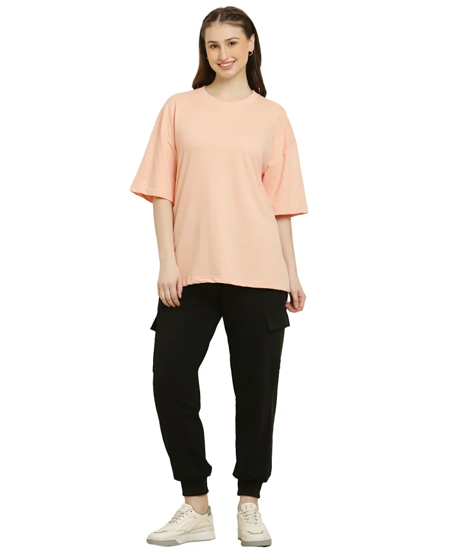 front view of peach oversize t-shirt worn by female model